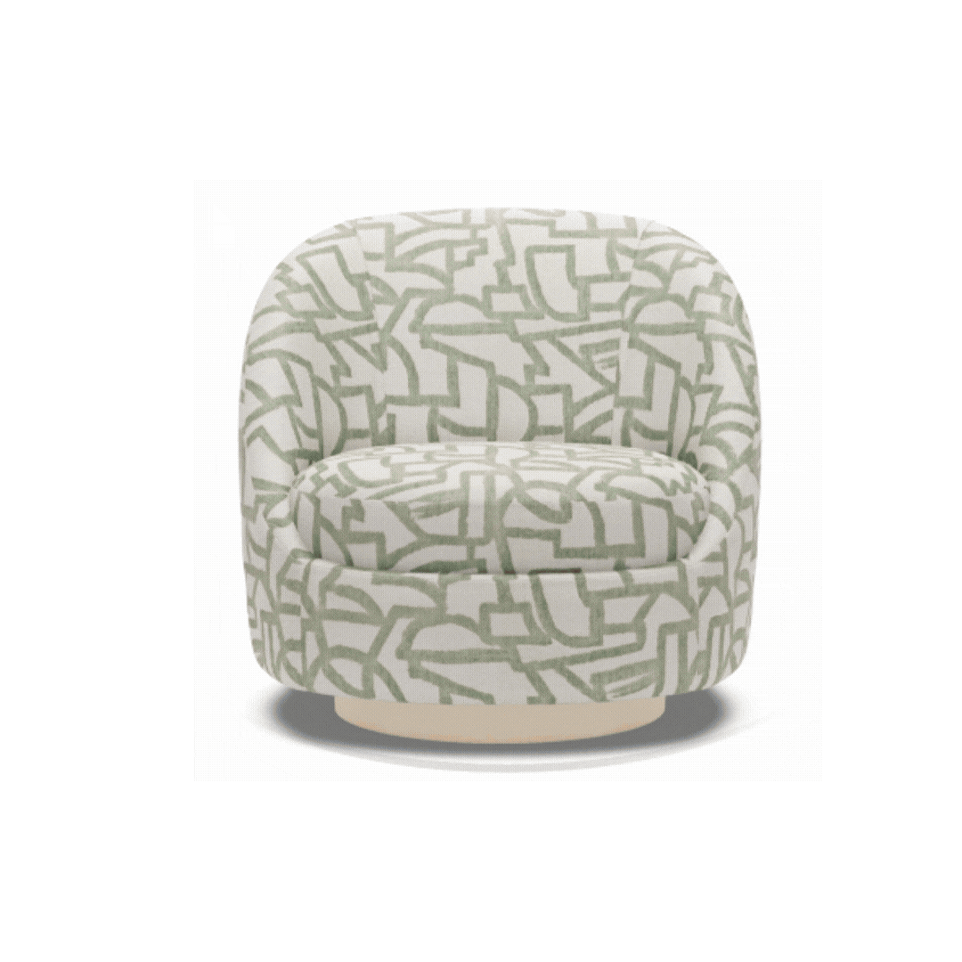 Rounded custom chair in a green geometric fabric