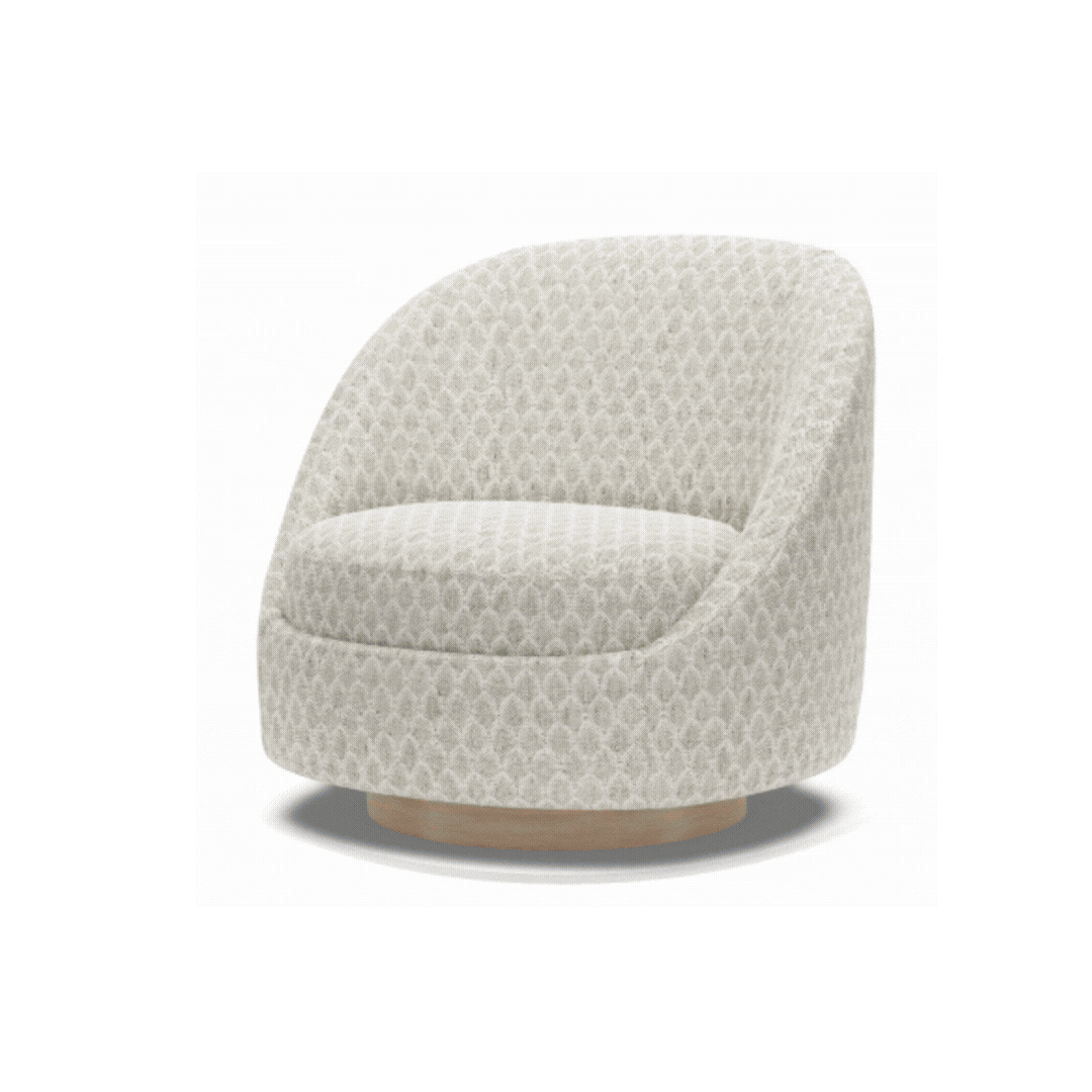 Rounded custom chair in a light neutral fabric