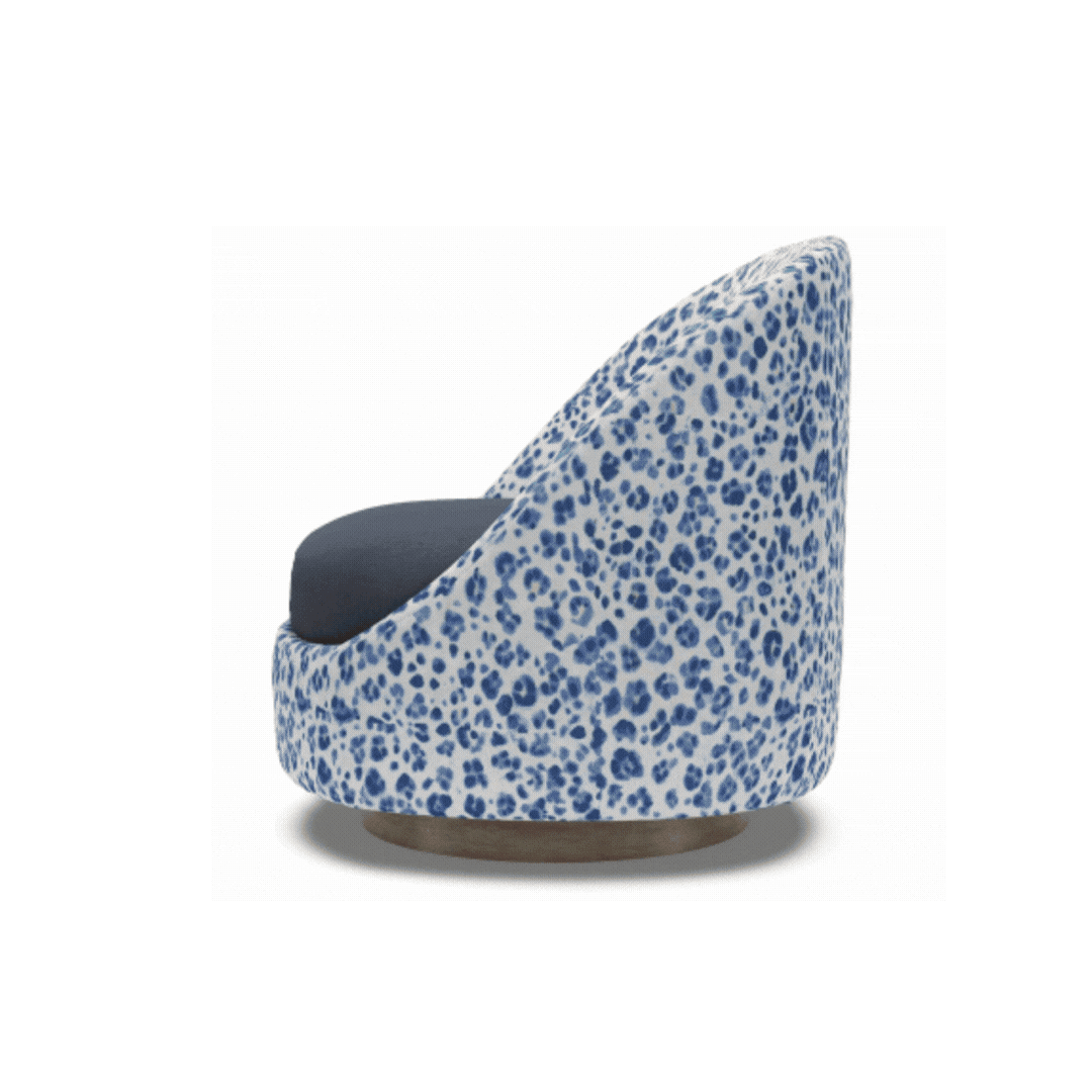 Custom swivel chair in a blue patterned fabric, shown from the side